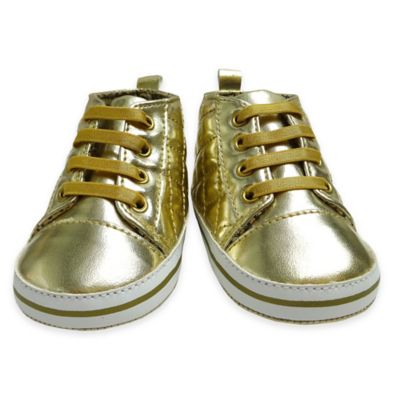 gold sneakers with stars