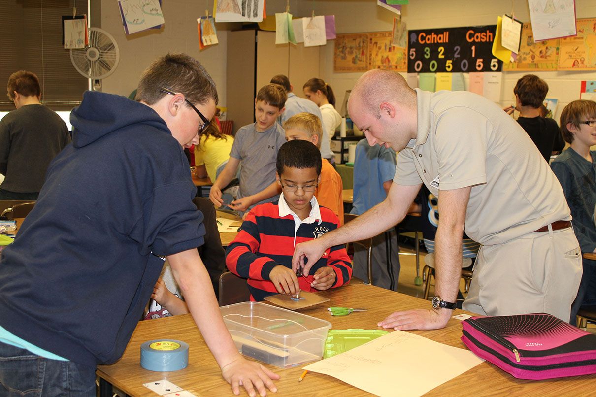 MSA employees help kids at a STEM event in a local classroom