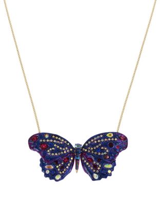 This chic, long necklace features a luxurious butterfly pendant. Its graceful wings are decorated with a collection of colorful stones and crystals that capture light and add a sense of movement to this stunning piece. Gold tone long necklace with purple butterfly pendant with mixed multi-colored stones and crystal accents Lobster claw Curb Antique gold tone Base metal/glass/plastic Long: 32" + 3" Ext Pendant Width 3.5" Pendant Drop 1.75"