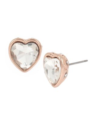 These luxurious heart-shaped earrings feature a faceted jewel in the center of a warm rose gold casing. These sweet studs will add a charming touch to any outfit. Crystal heart-shaped stone studs with rose gold tone details Post back Rose gold plating Metal/glass Length: 0.5" Width: 0.5"