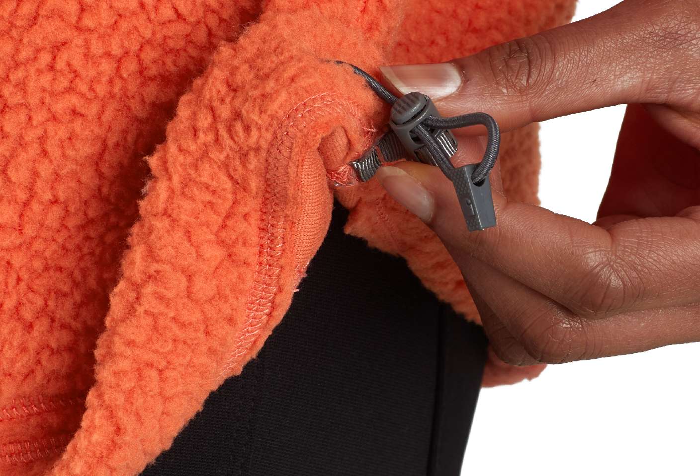 An adjustable hem with a toggle cord pulls tight to keep out the cold