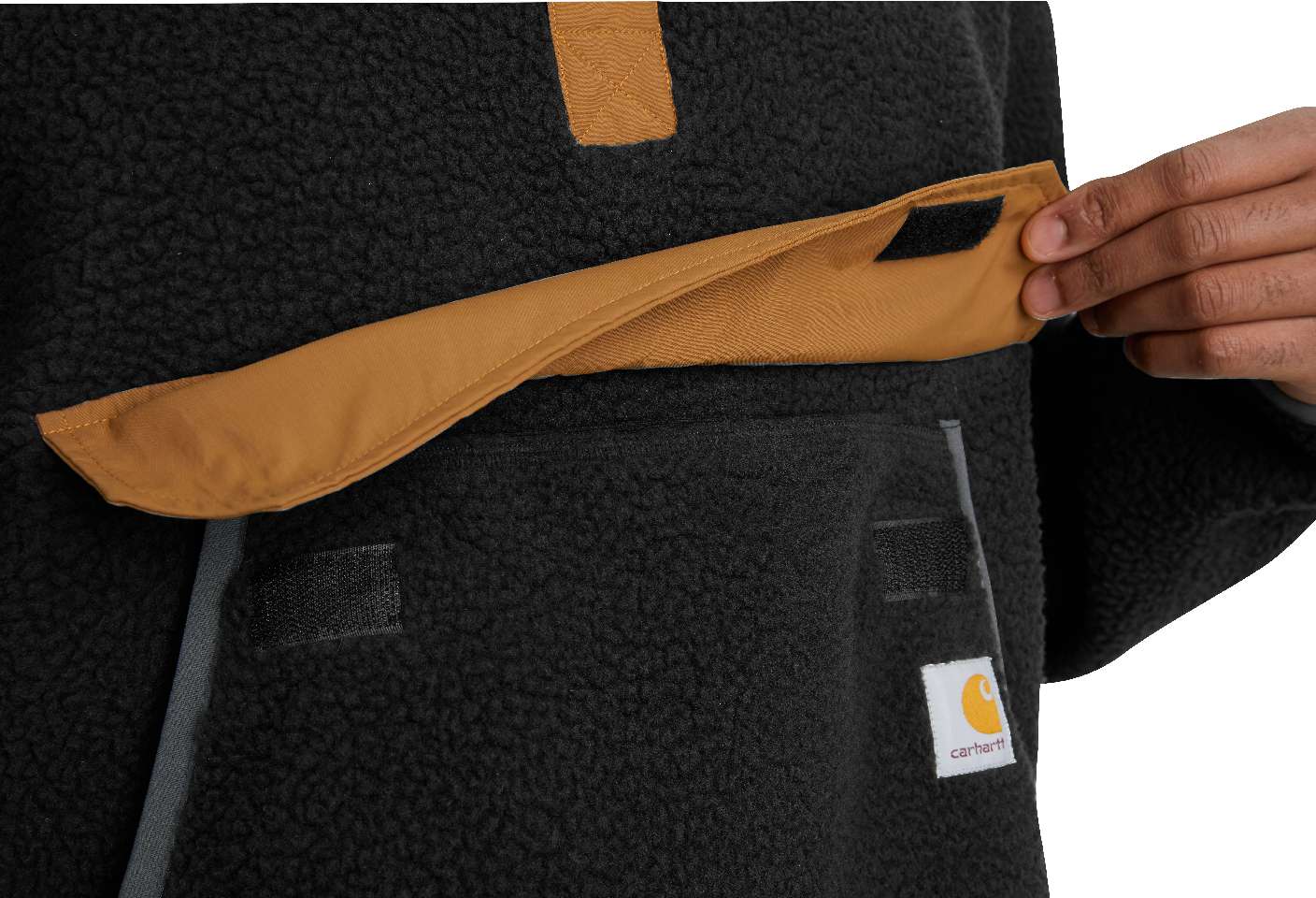Reinforced front pocket has a top flap and a side entry