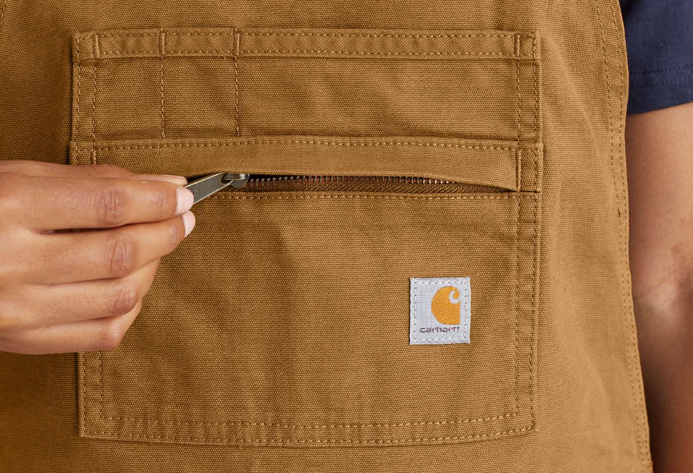 A zip pocket keeps essentials secure.