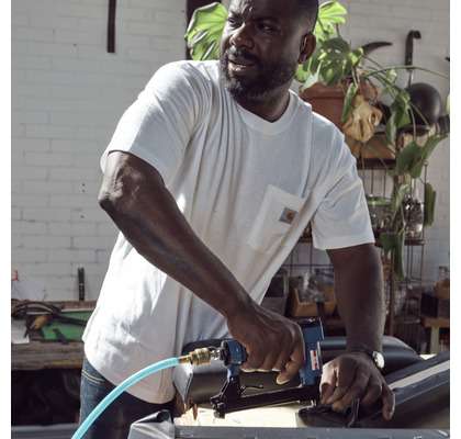 working man wearing Carhartt t-shirt