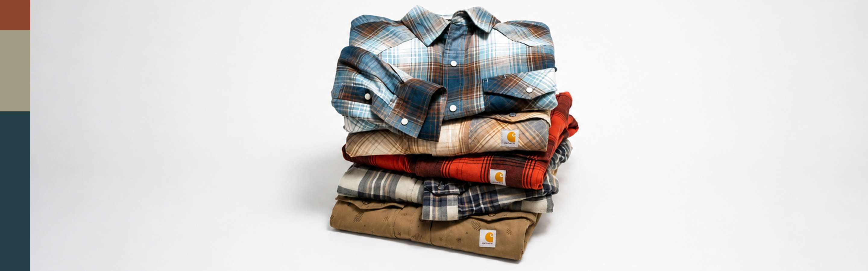 A stack of Carhartt check shirts