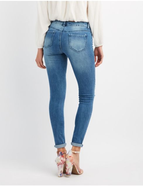 Patched & Distressed Skinny Jeans | Charlotte Russe