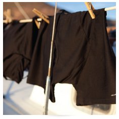 shorts drying on clothes line on boat