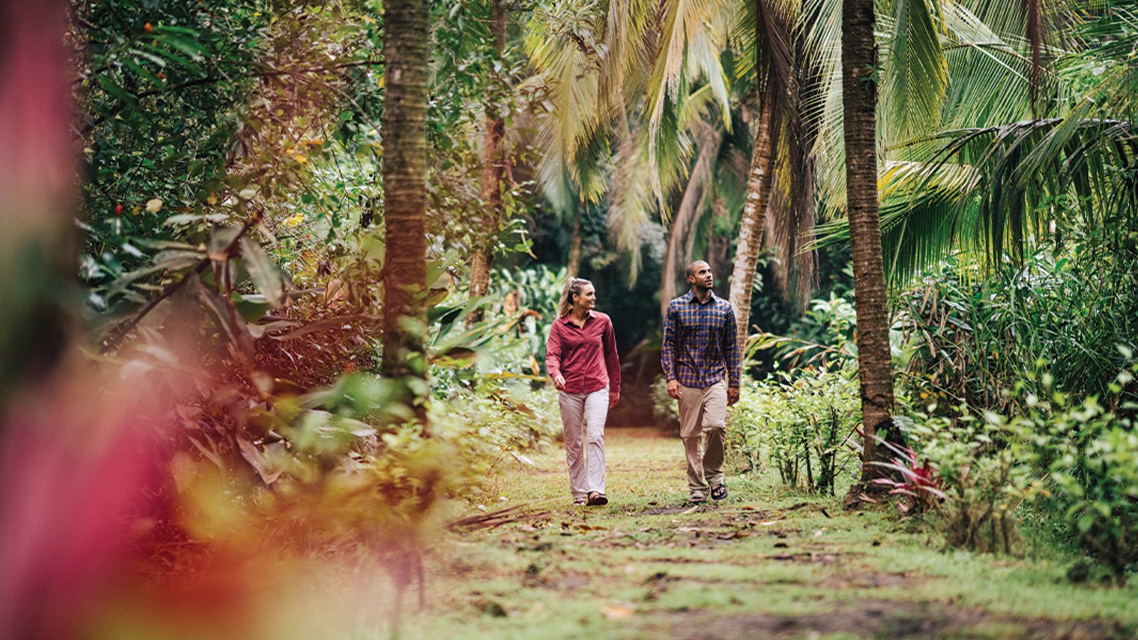 man and woman hiking wearing long sleeve hiking shirts and pants