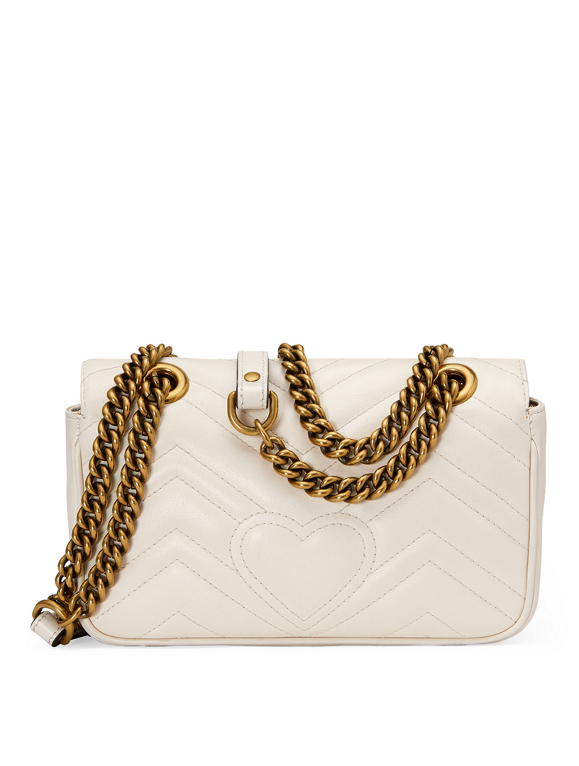 white gucci purse with gold chain