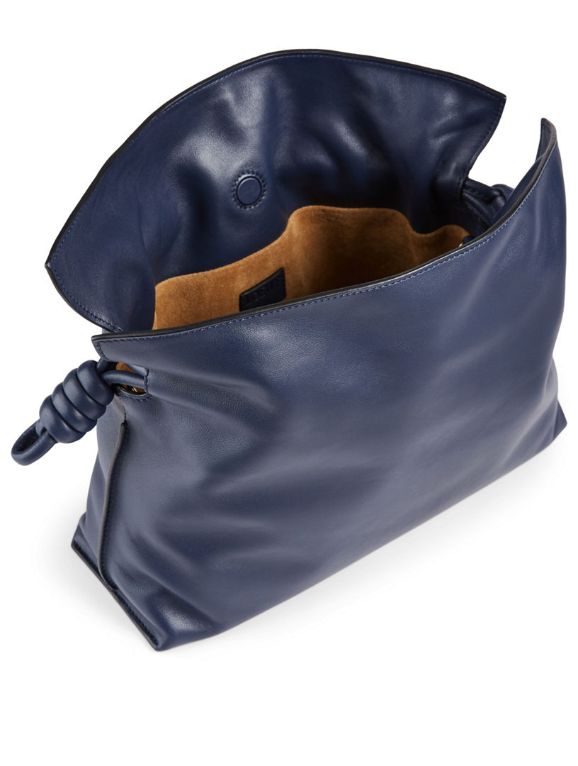 blue leather clutch bag