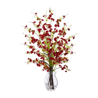 red artificial flowers in vase