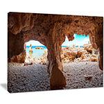 Designart Denia Las Rotas Beach Caves Landscape Artwork Canvas