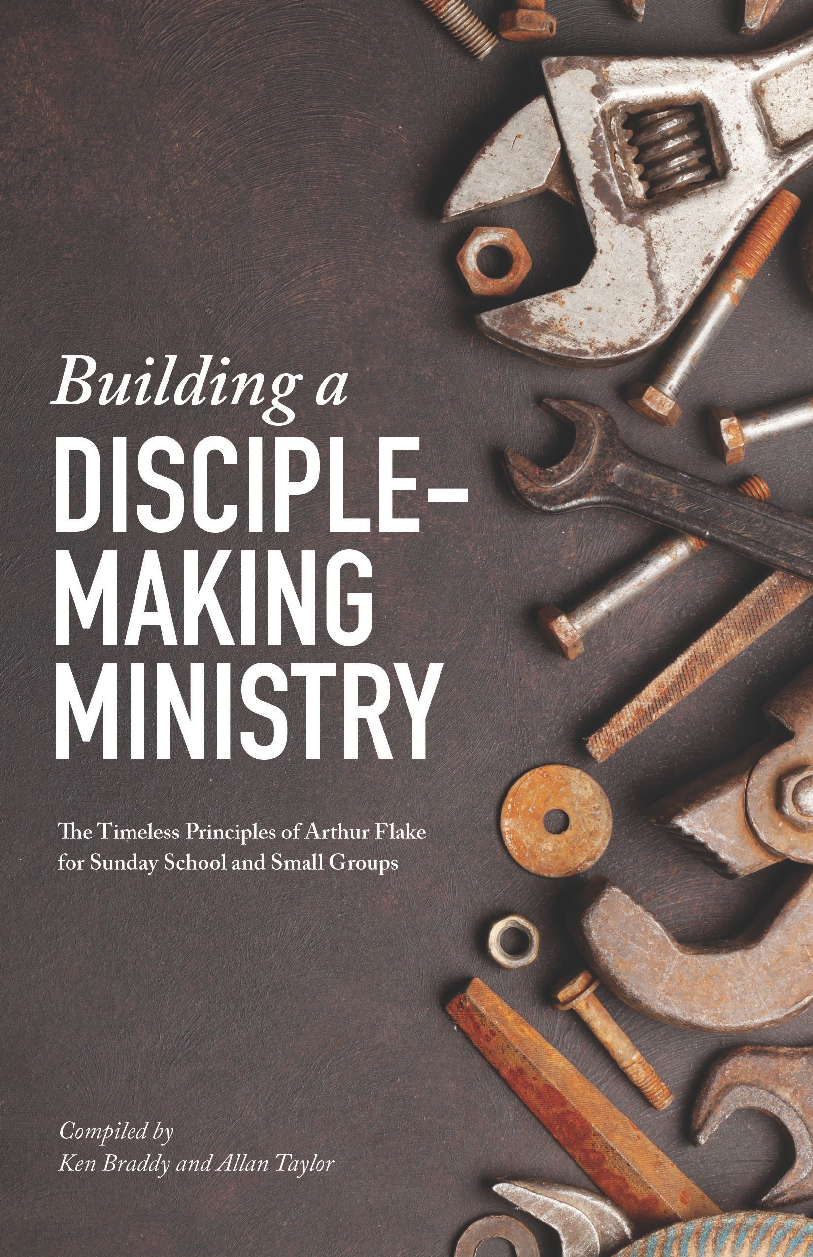 Cover of Building a Disciple-Making Ministry featuring wrenches and bolts on a dark background.