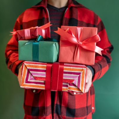 Person holding wrapped gifts