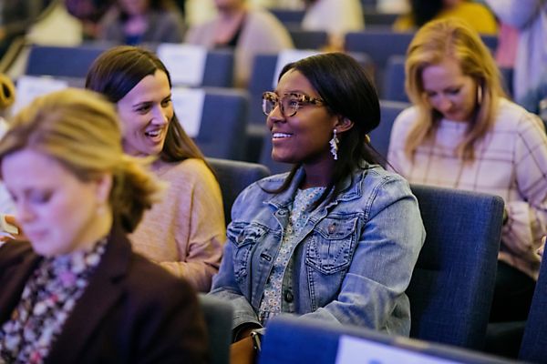 women smiling in chairs