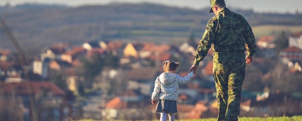 Soldier and daughter walking