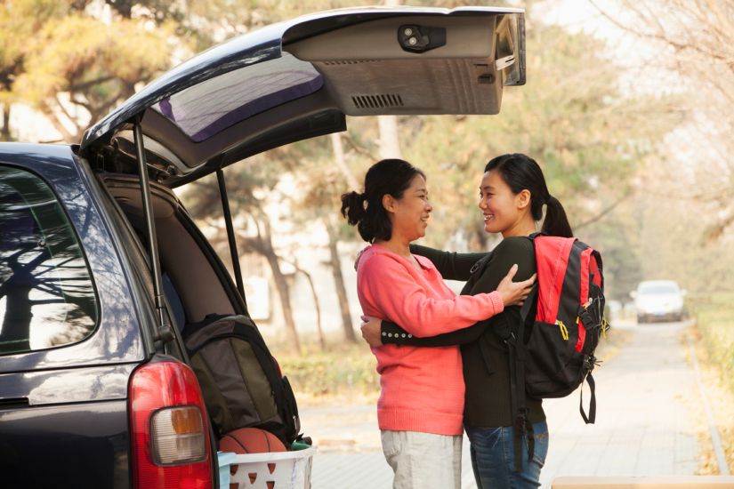 Asian mother hugging and sending