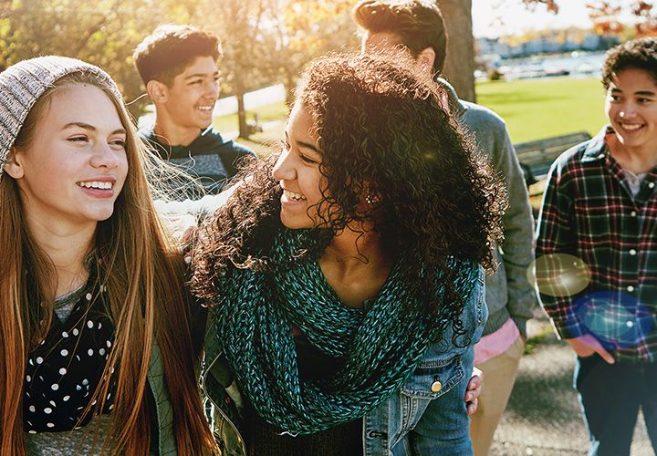 teens walking and smiling