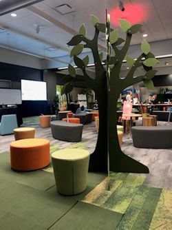 Soft seating and decorative tree at EDspaces 2021