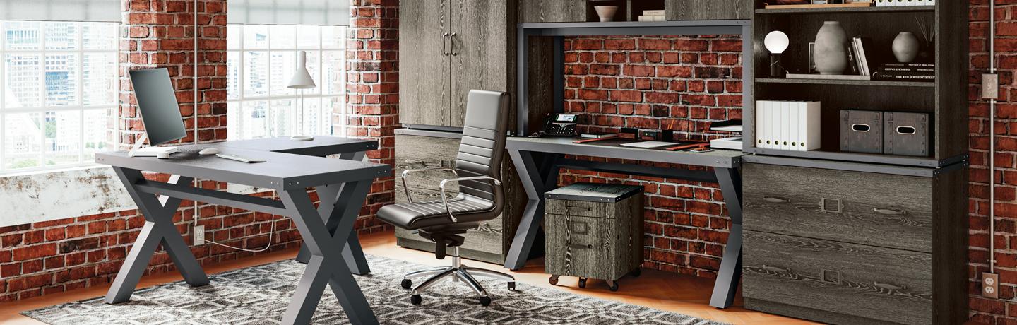 Urban office setting with contemporary gray l-desk and matching table