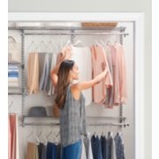 a woman touching clothing on a built-in clothing organizer image number 4