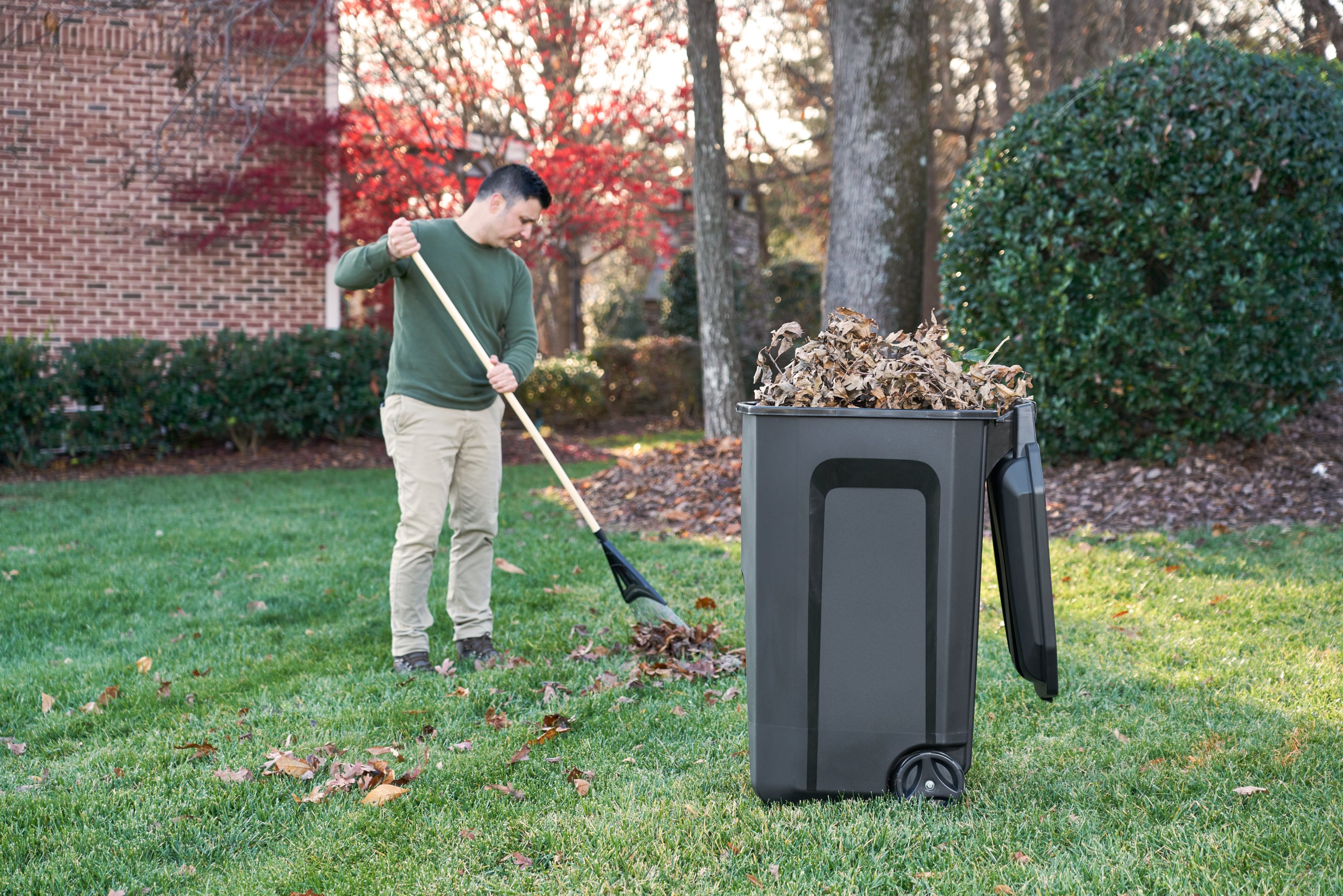 Roughneck 45 Gal. Black Wheeled Vented Trash Can with Lid