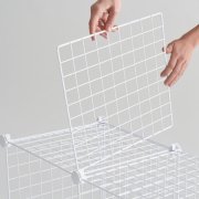 person assembling storage cubes image number 3