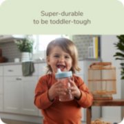 Toddler with Nuk sippy cup that is super durable to be toddler tough image number 2