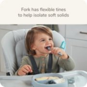 child using suction plate and utensils image number 4