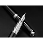black and white uncapped fountain pen crossed over capped pen image number 6