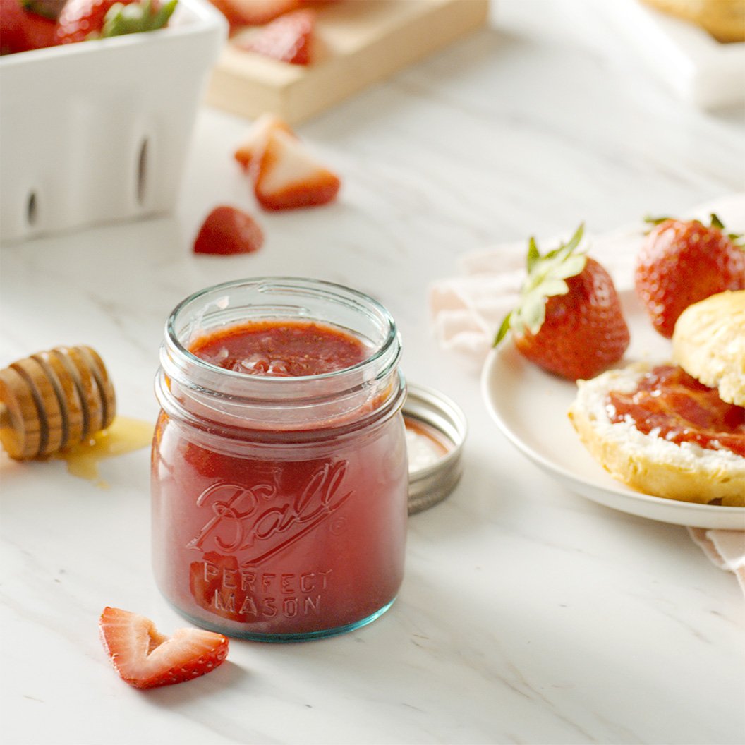 Canned fruit spread in mason jars on kitchen counter