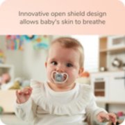 Baby using pacifier image number 3