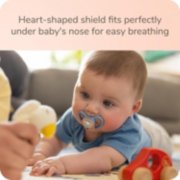 Baby using pacifier image number 4