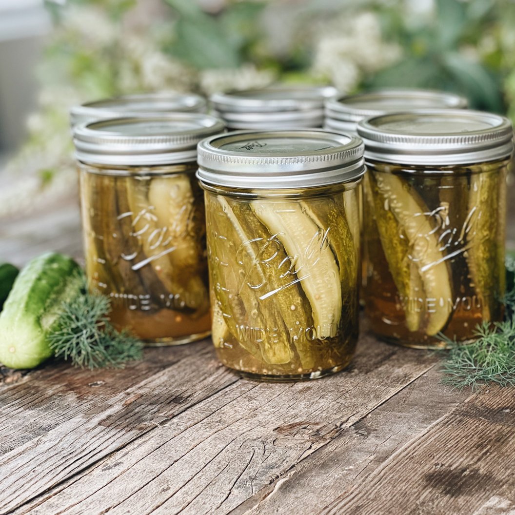 sealed jars of pickles on table