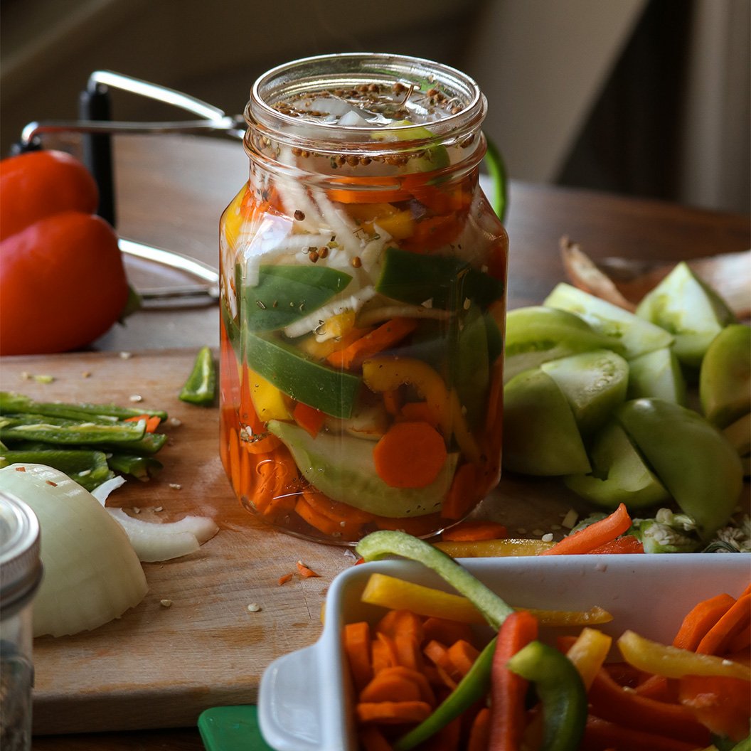Glass jar filled with preserved vegetables