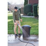 man washing down outdoor refuse bin image number 7