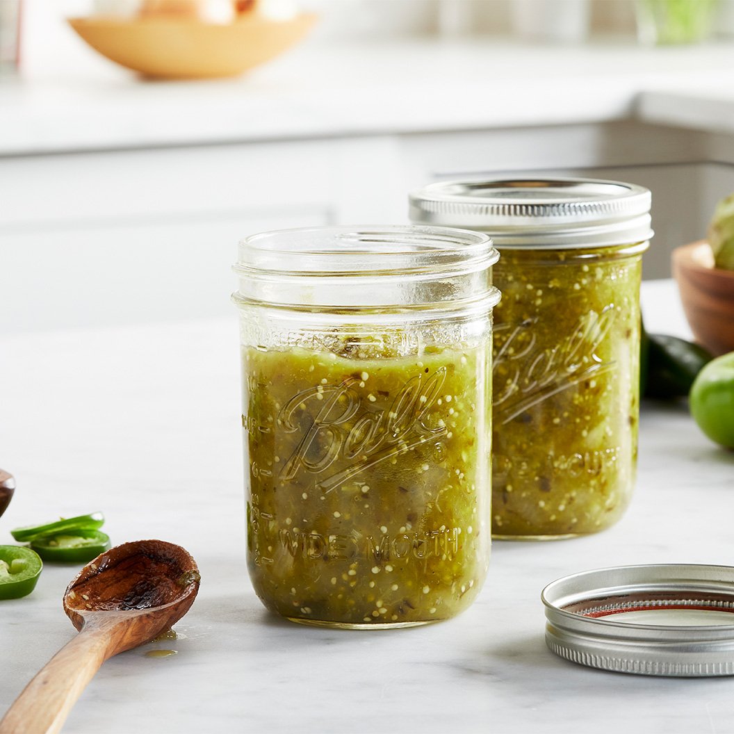 Two jars of green salsa