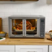 Rotisserie turkey cooking in Oster french door air fryer image number 2