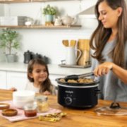 woman and child cooking with slow cooker image number 5