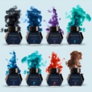 Eight Waterman ink bottles with ink colored smoke rising behind them. image number 4