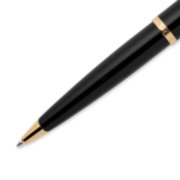 Closeup of a Carene ballpoint pen tip and barrel with gold trim. image number 4