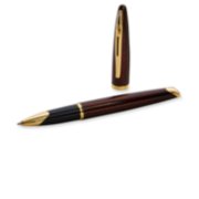 A Carene rollerball pen with gold trim laid next to an upright pen cap. image number 4