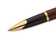 Closeup of a Carene rollerball pen tip and barrel with gold trim. image number 5