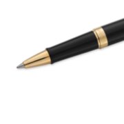 Closeup of a Hemisphere rollerball pen tip and barrel with gold trim. image number 5