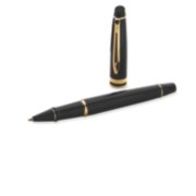 An Expert rollerball pen with gold trim laid next to an upright pen cap. image number 4