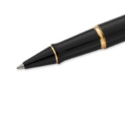 Closeup of an Expert rollerball pen tip and barrel with gold trim. image number 5