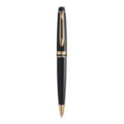An Expert ballpoint pen with gold trim stood upright with pen tip pointing down. image number 1
