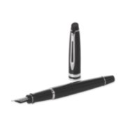 An Expert fountain pen with chrome trim laid next to an upright pen cap. image number 4