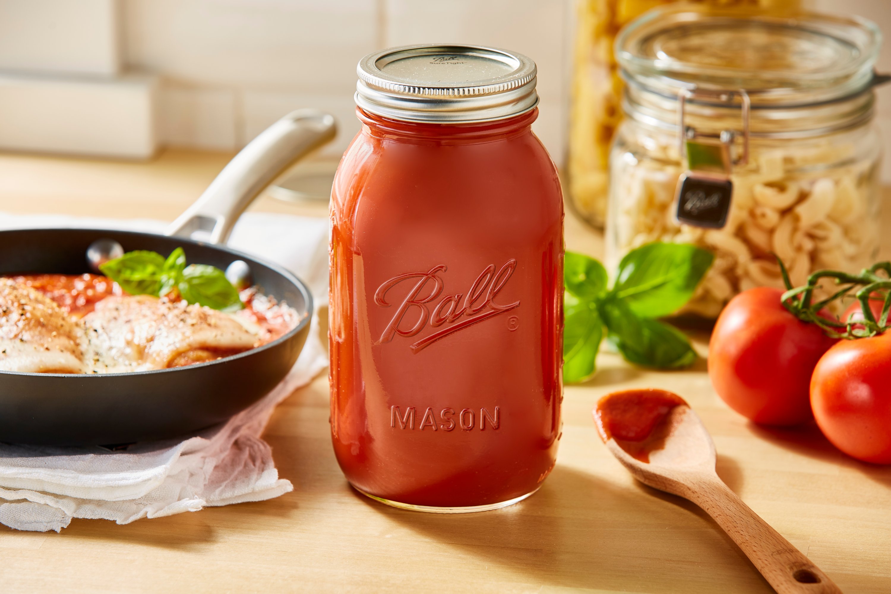 sauce in mason jars on table