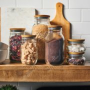 wooden lid mason jars on kitchen shelf image number 3